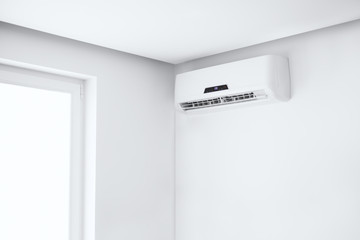 Split air conditioner on a white wall.