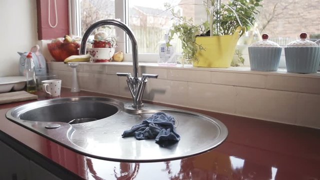 Dish Cloth Falling In Slow Motion Onto Sink - Chores All Finished