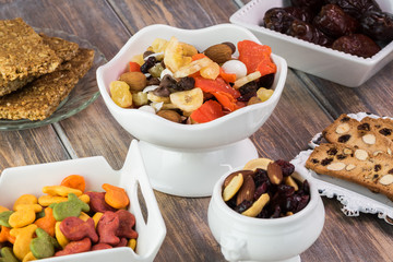 Snacks. Sweet tropical nut trail mix, granola bars, goldfish crackers, almond biscuits.