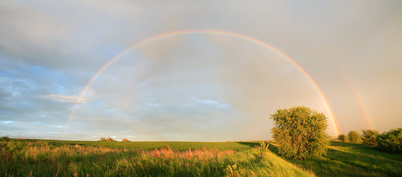 Rainbow over Rural Landscape after Thunderstorm
