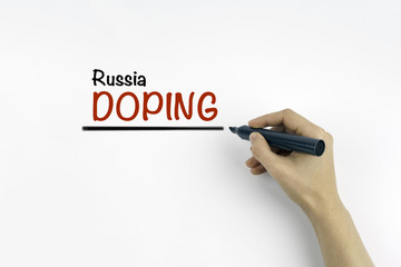 Hand with marker writing - Russia Doping