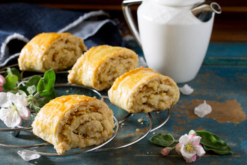 Georgian puff pastry stuffed with Gata on a wooden background. E