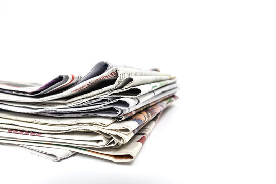 Stock of newspaper on white backgroung.Image with clipping path.