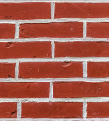 pattern of red painted brick wall