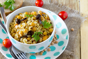 Vegetarian vegetable pilaf with chickpeas and wild mushrooms on