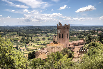 Fototapeta na wymiar View over the impressive landscape in Tuscany with the cathedral of San Miniato in Italy 