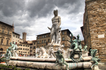 Fototapeta na wymiar Statue of Neptune on the piazza della Signoria in Florence in Italy 