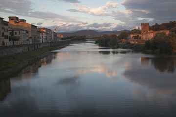 Fototapeta na wymiar Sunset at a Tuscan landscape with the Arno river near the city of Florence, Italy 