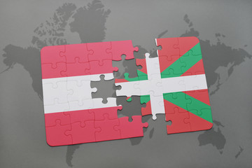 puzzle with the national flag of austria and basque country on a world map background.