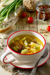 Vegetarian vegetable soup with chickpeas, potatoes and dried tom