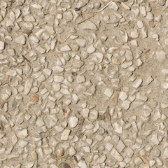 Abstract pebble stones in concrete background texture macro, selective focus