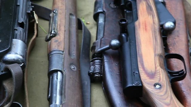 Close up of historical rifles and machine-guns