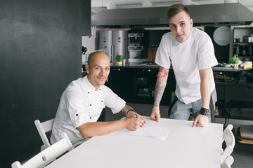 Student and chef at table