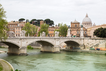 Fototapeta na wymiar ROME, ITALY - APRIL 8, 2016: St Peter's basilica in Vatican, river Tiber view and Roma'n bridge 