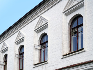 Fototapeta na wymiar Windows on the white wall of the house