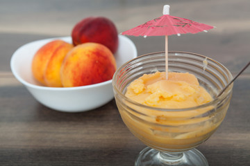 Frozen peach yogurt with with fresh fruits