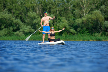young couple paddling on sup board02
