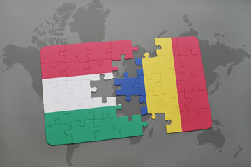 puzzle with the national flag of hungary and romania on a world map background.