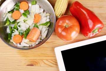 Vegetables with a digital tablet pc. Healthy food concept.