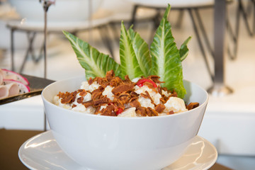  potato salad with bacon in a bowl close up