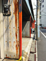 Alley of Japanese everyday rusty wall lined