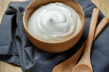 Greek yogurt on wooden background