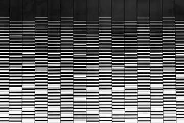 High building texture with reflection of sky and cloud.