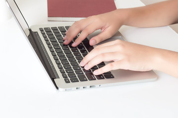Fototapeta na wymiar Closeup of woman's hand working with laptop, selective focus