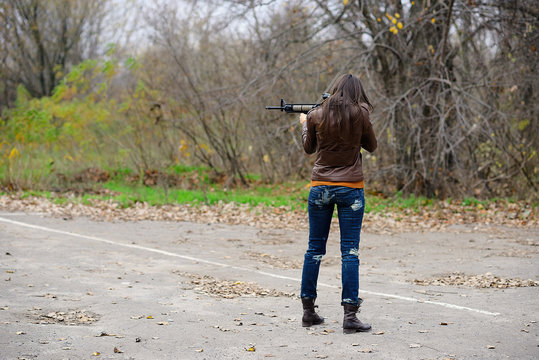 girl with automatic weapons