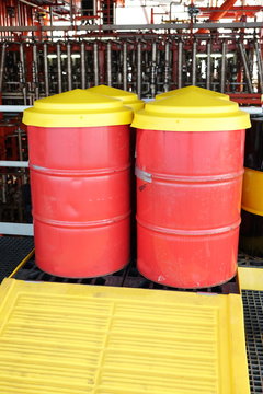 Oil Drum with cover and tray on oil and gas platform.