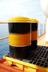 Oil Drum with cover and tray on oil and gas platform.