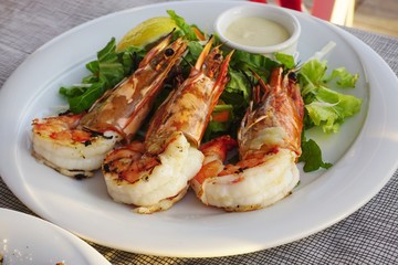 Dish of grilled shrimp with head on