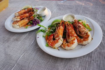 Dish of grilled shrimp with head on