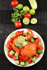 Overhead view-Boiled crab dish and vegetables