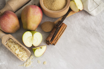 Apple pie ingredients over stone table