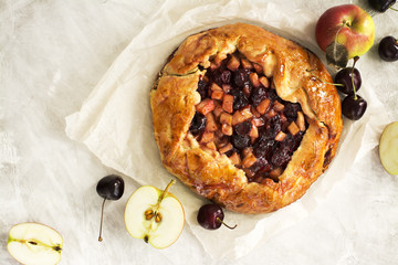 Apple and cherry pie with ingredients