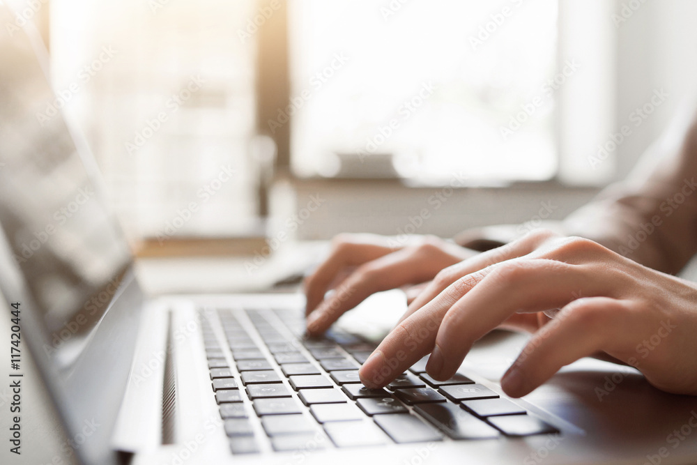 Wall mural typing on laptop closeup, chatting in facebook, meeting website. blogger, journalist writing new art