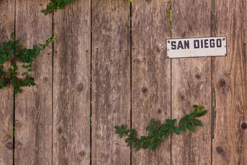 Weed in Wood fence San Diego