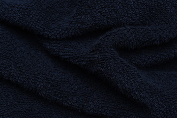 Fototapeta na wymiar Black towel closeup as background