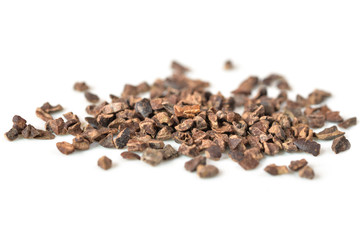 Cacao nibs on white background - isolated