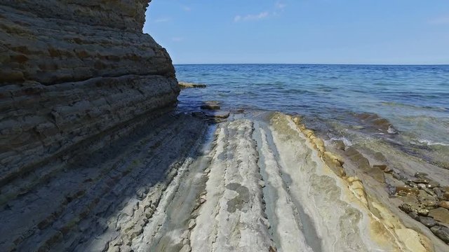Coastline area near old city Piran and Strunjan, nice place for swimming with St. George's Parish Church view. Summer day, clear water in the sea and blue sky. Slovenian Istria, Slovenia, Europe.