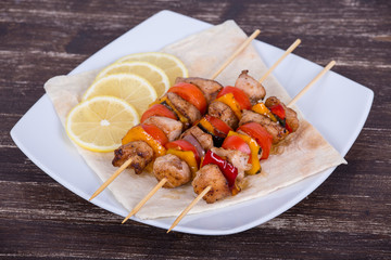 Tasty grilled meat and vegetables on skewer