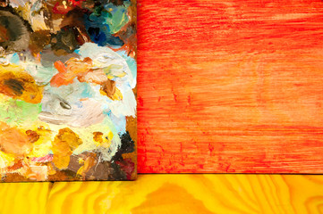 Fototapeta premium Painting palette on colored wooden background