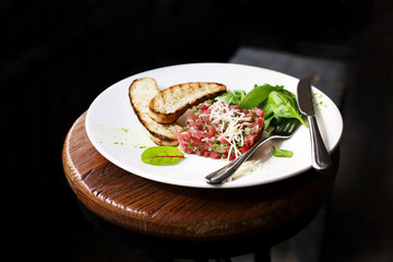 Tartare of beef with spinach.