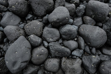 Fototapeta na wymiar roche galet cailloux pierre noir volcanique volcan plage bloc