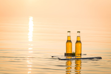 Beer bottles floating on the wooden board