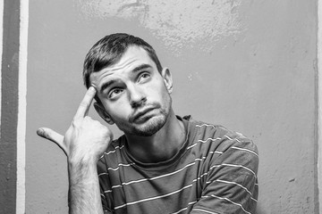 young man with beard with different emotions. black and white. emotional card. close up of a funny young man.