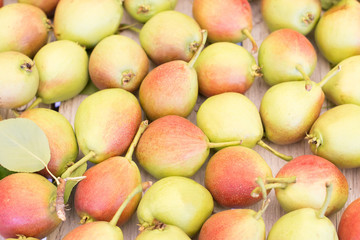 Ripe sweet yellow red pears background 