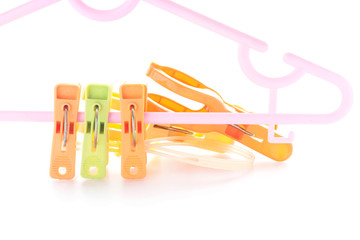 Plastic clothes pegs isolated on white background.