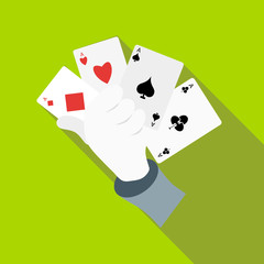 Hand in white glove holding four playing cards icon in flat style on a green background